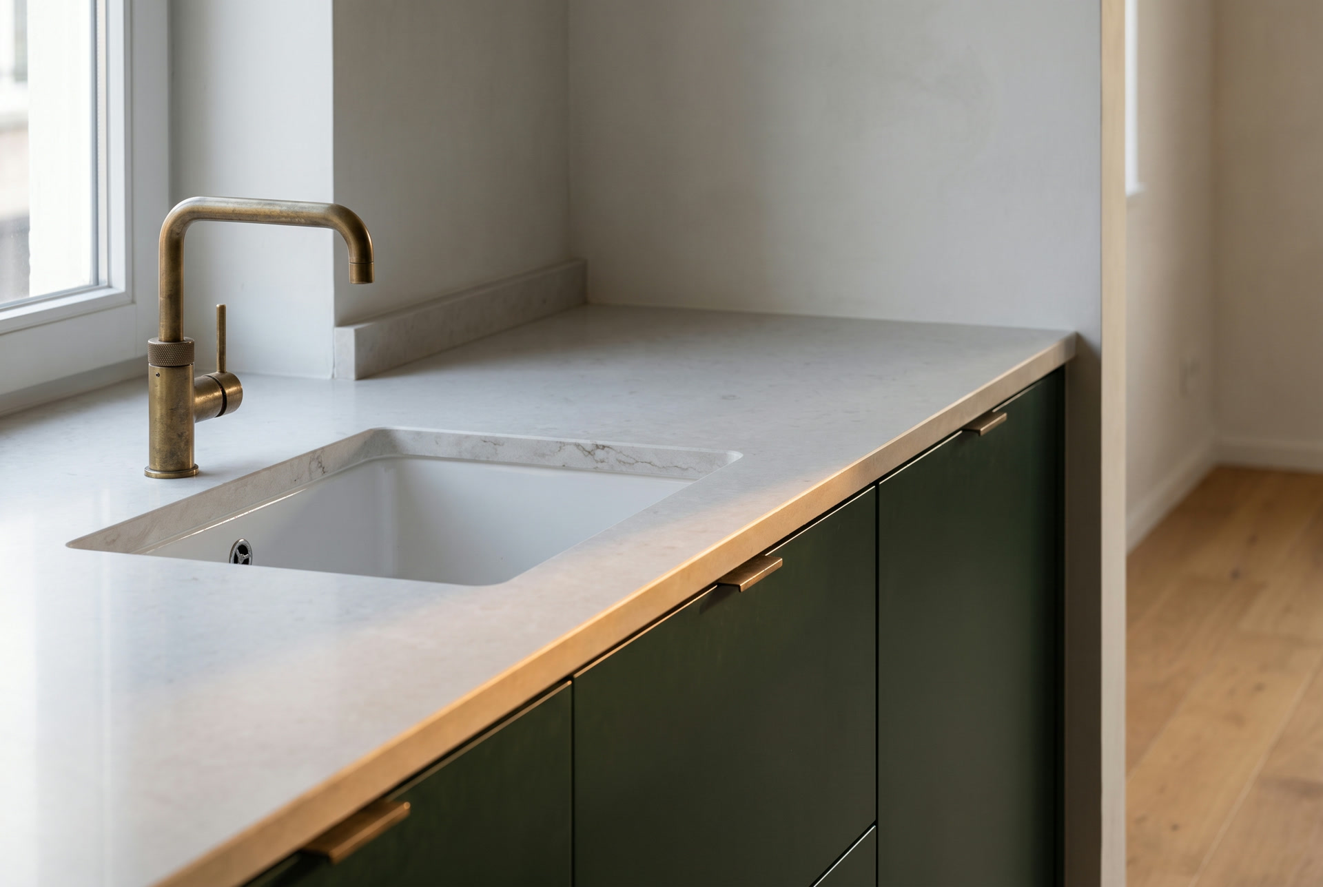 Quartz worktop with undermount sink and brass tap, illustration